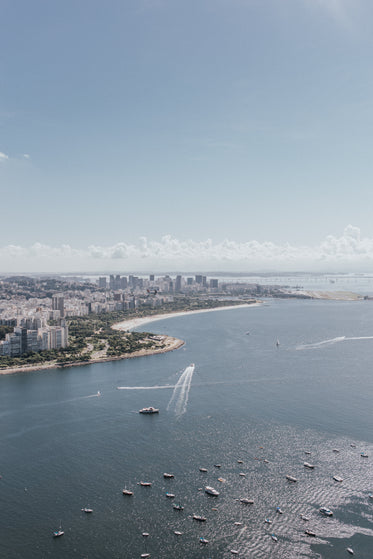 aerial photo of a waterfront city with boats