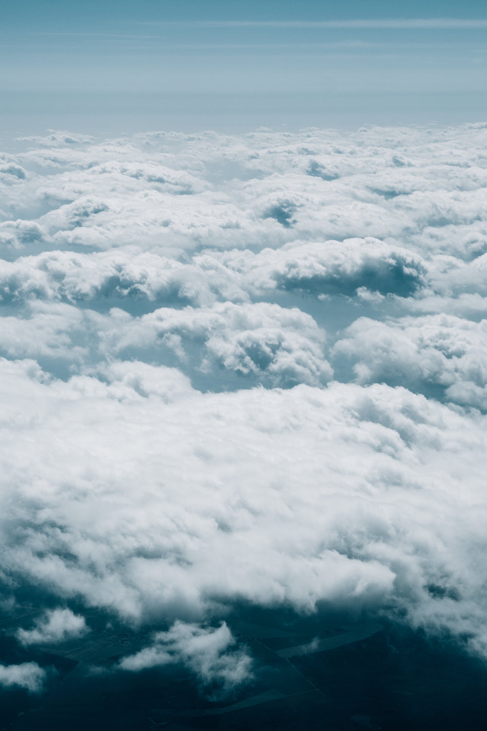 aerial photo of fluffy white clouds over horizon