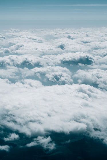 aerial photo of fluffy white clouds over horizon