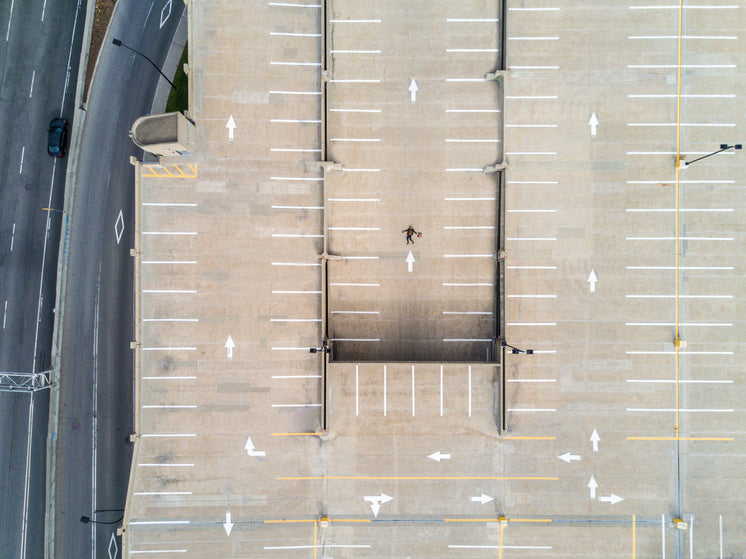 aerial-shot-of-person-atop-parking-lot.j