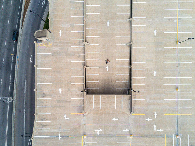 Aerial Shot Of Person Atop Parking Lot