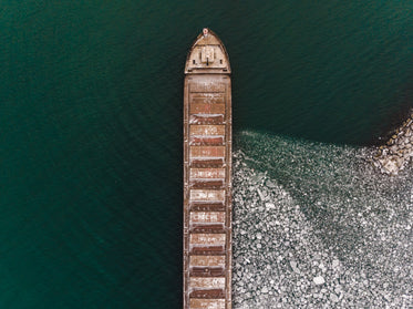 aerial view of a boat on icy water