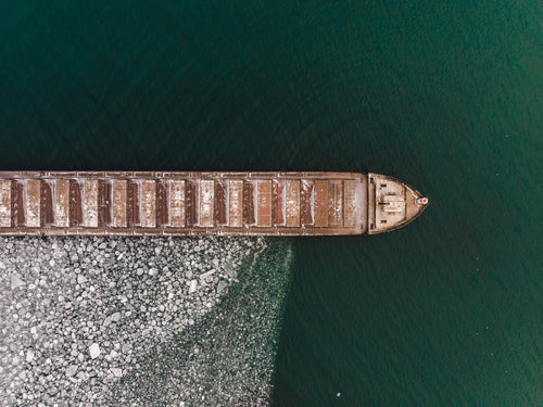 aerial view of a boat surrounded by ice