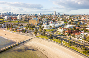 aerial view of coastal city and roller coaster