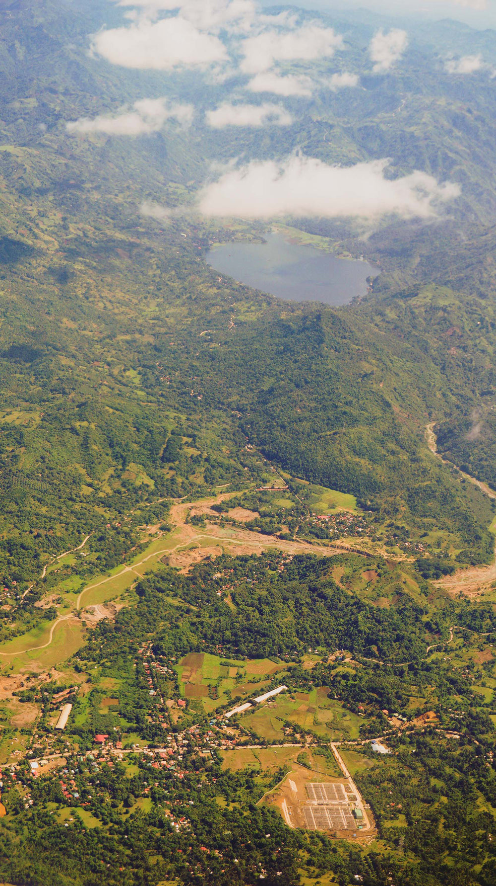 aerial view of lake surrounded by mountains