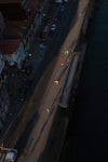 aerial view of people scrolling across a boardwalk