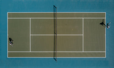aerial view of two people playing tennis in the sun