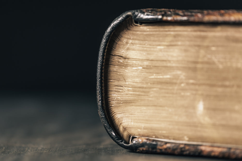 aged leather-bound book with yellowing pages