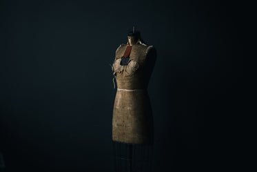 aging dress form in dark room