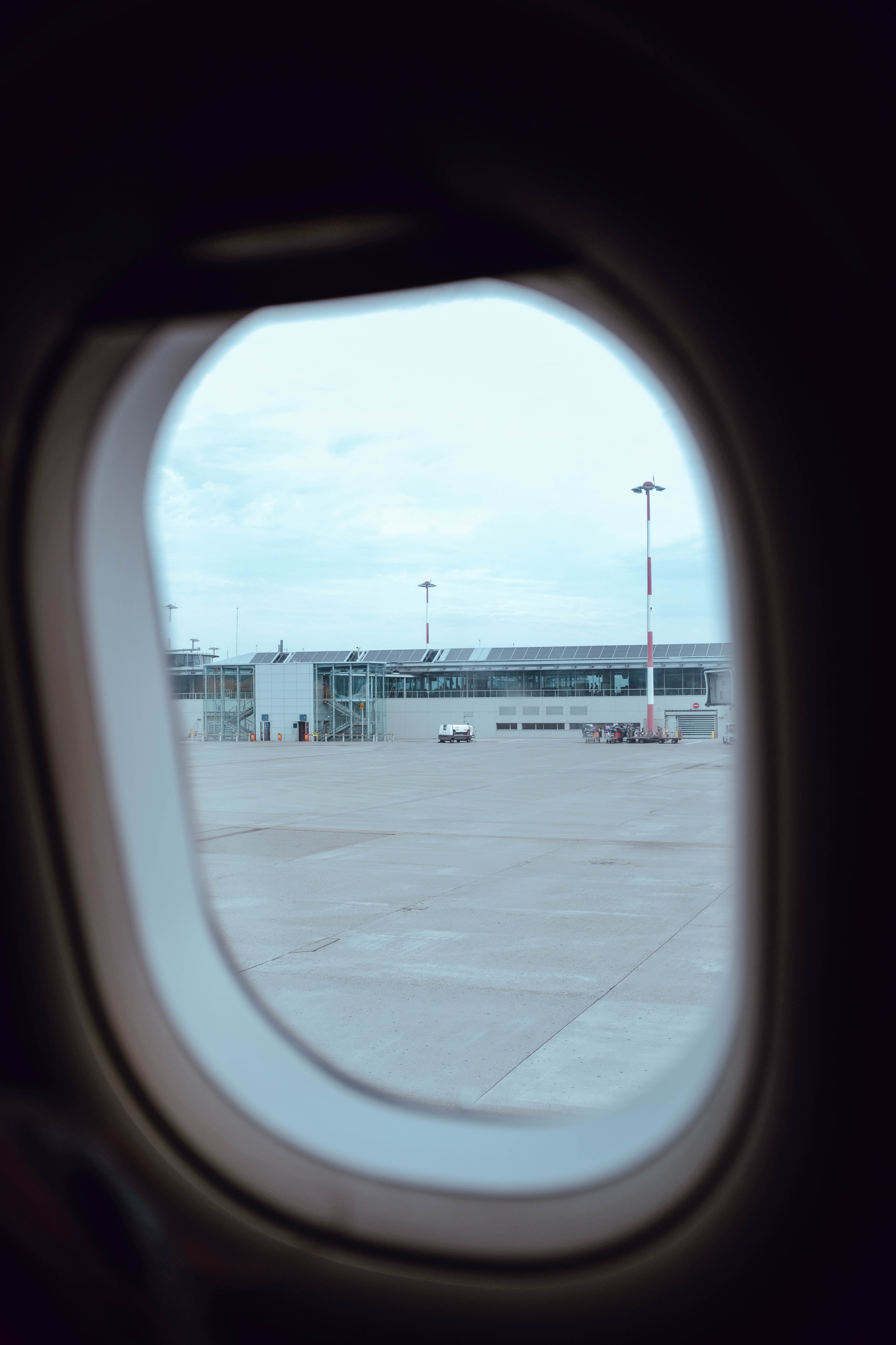 Picture of Airport Through Plane Window — Free Stock Photo