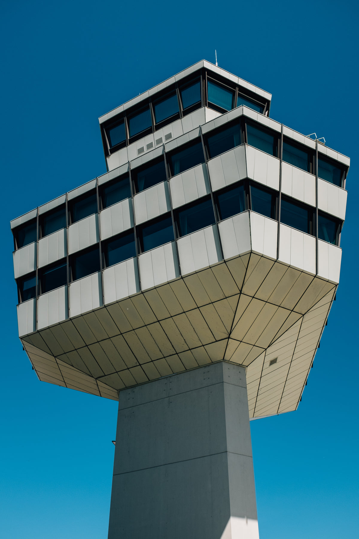 airport tower under deep blue skies