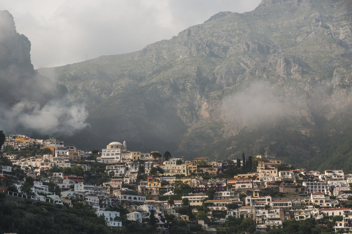 amalfi coast town with mountains behind