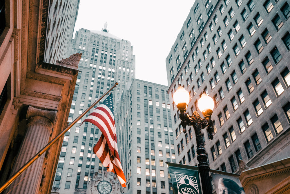 american flag near lamp post