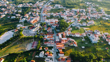 an aerial view of a city at sunset