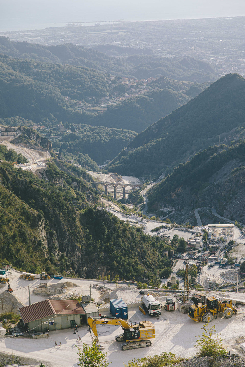 an aerial view of construction in a mountain range