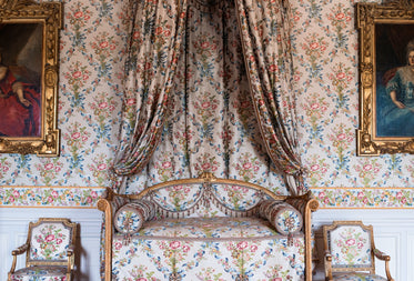 an antique couch with matching curtains