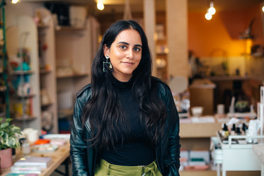 an entrepreneur standing in her store