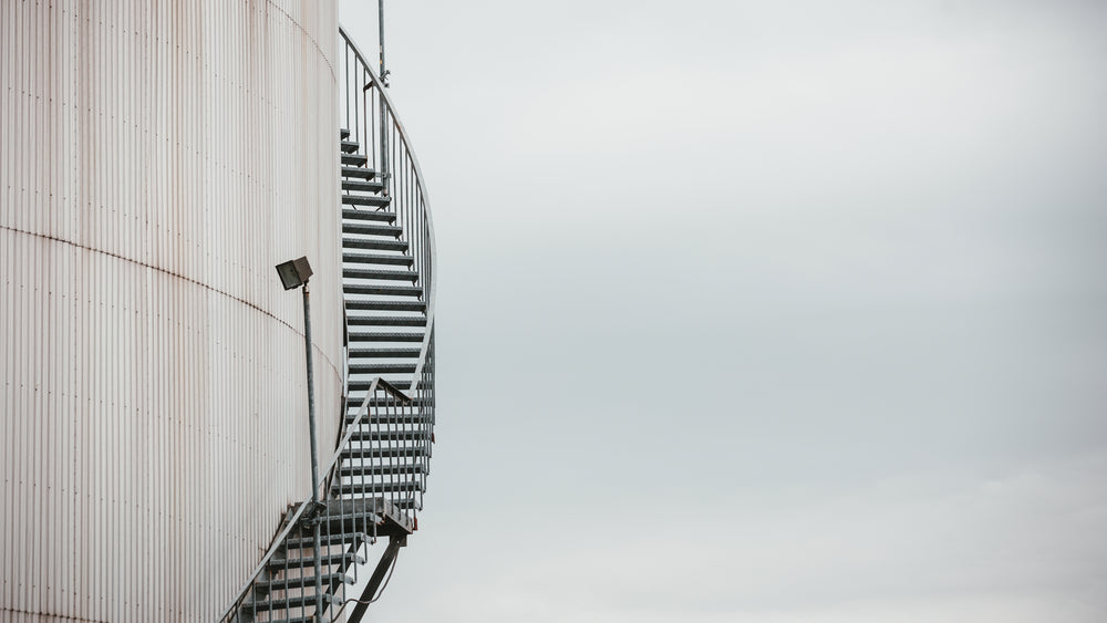 an iron staircase winds around a building