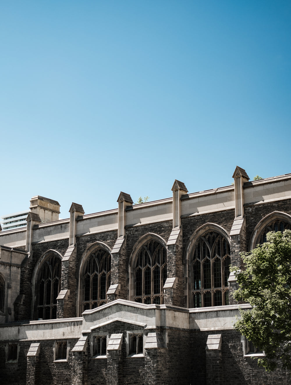 an old church under a rich blue sky