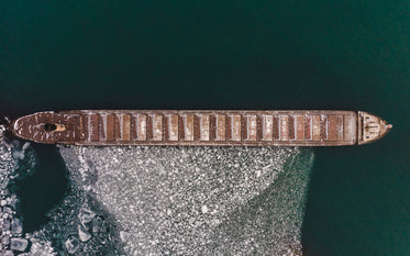 an old ship creating a barrier of ice