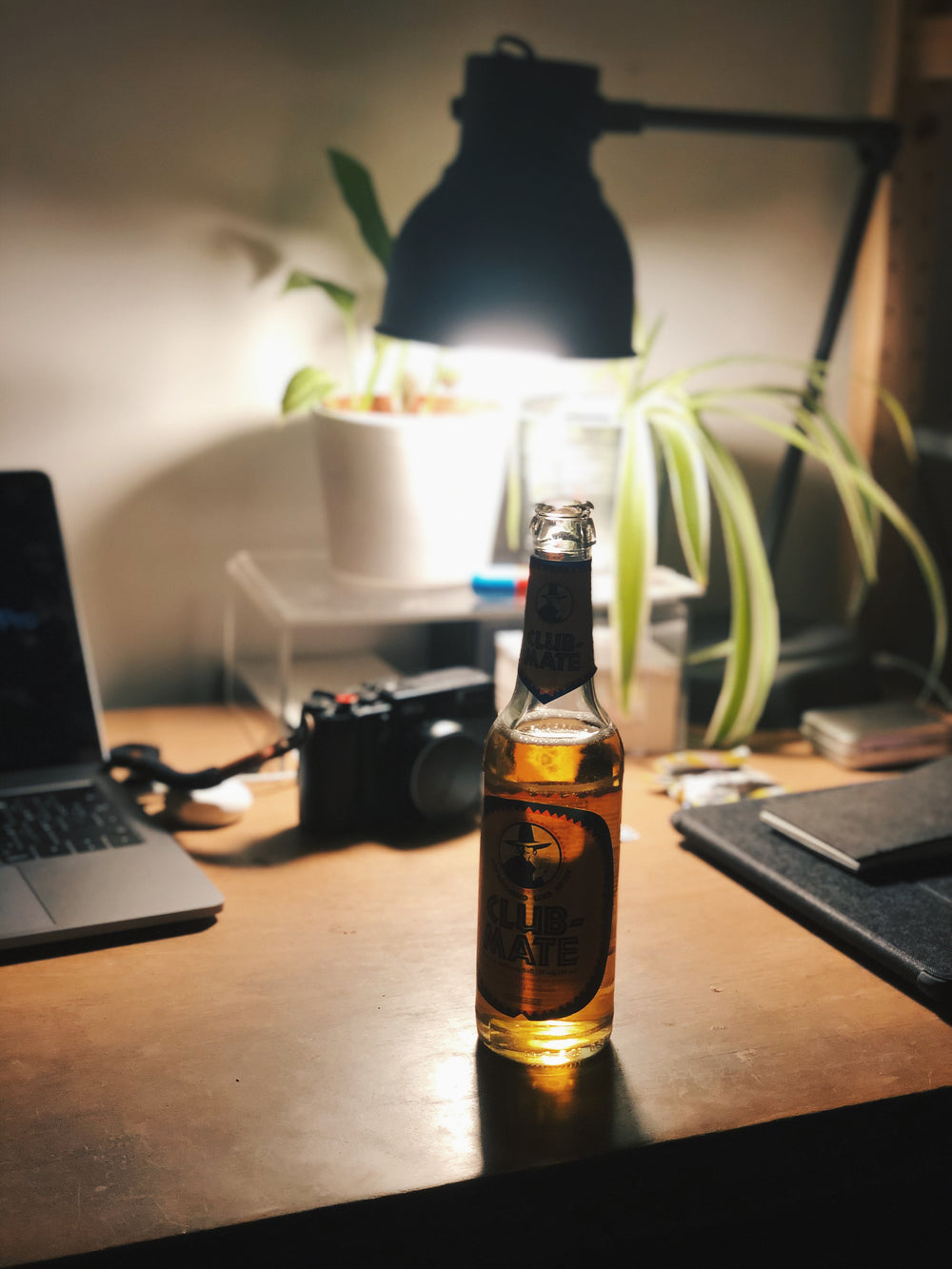 an open beer on a shadowy table