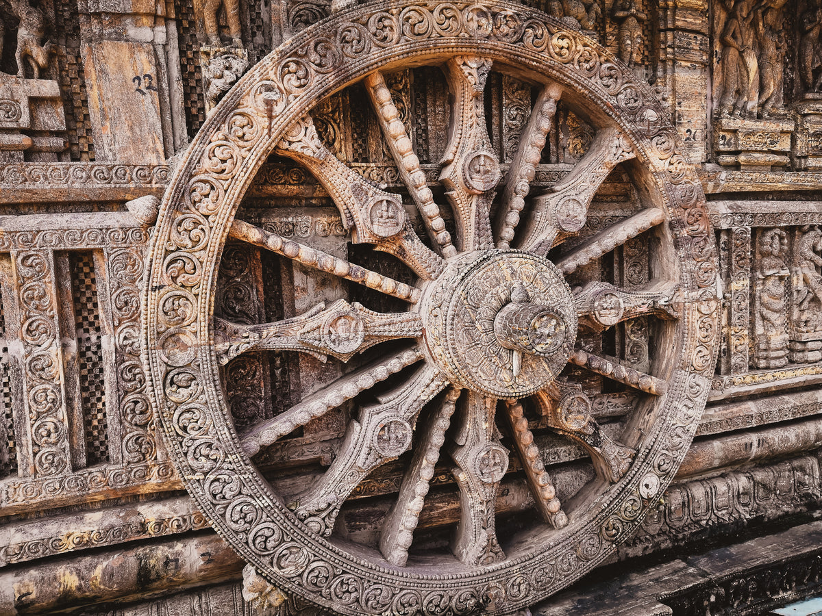 an ornate carved dharma wheel