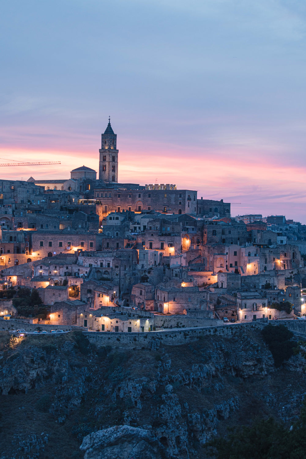 ancient mountain side city at sunset