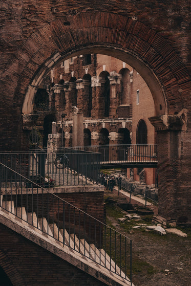 ancient stone building viewed through an archway