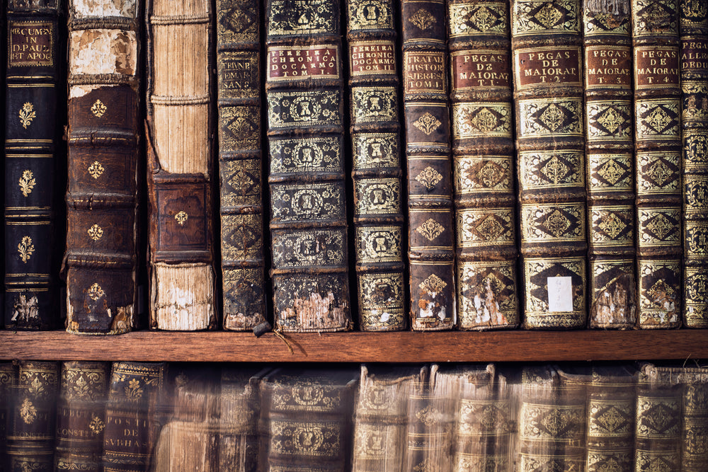 antique books on a library shelf