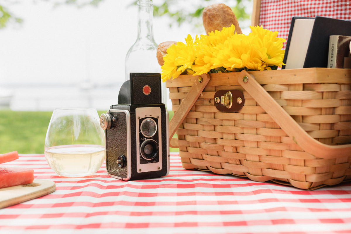 antique camera with picnic basket and wine