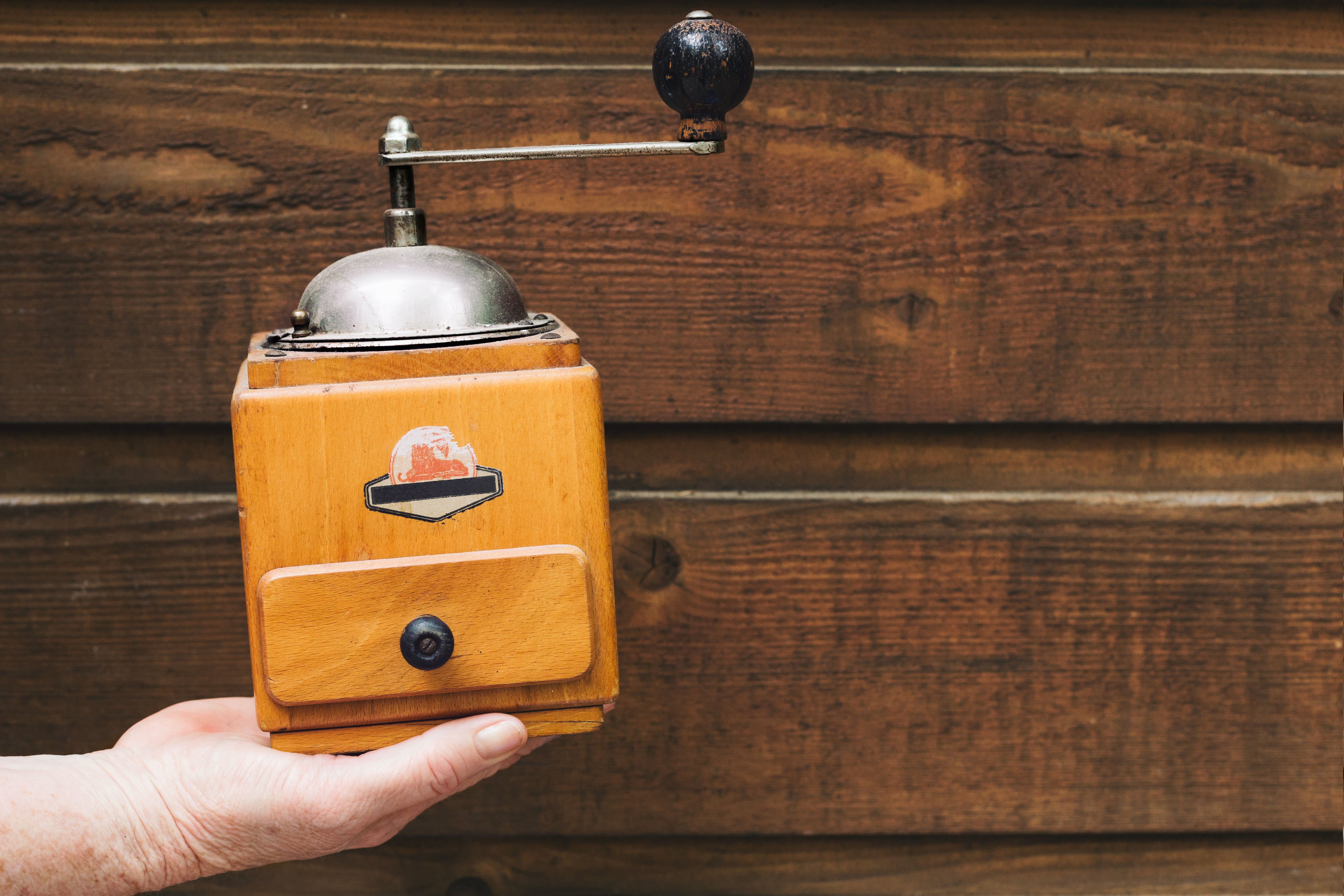 Antique Coffee Grinder In Hand