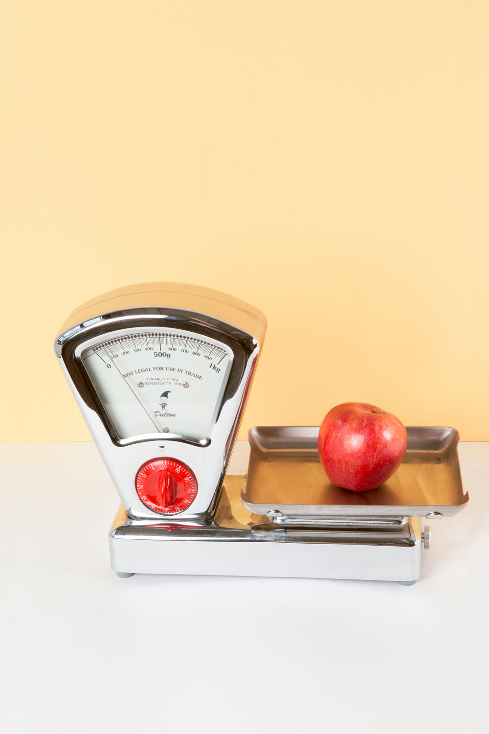 antique kitchen scale weighing apple