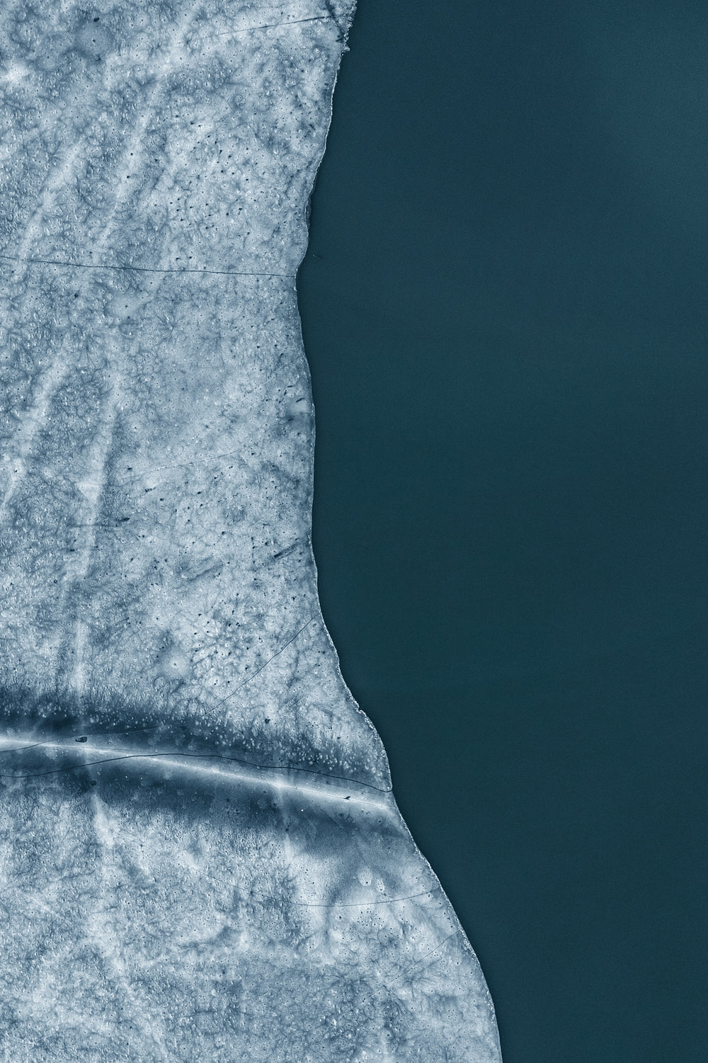 ariel view of ice formations along the water