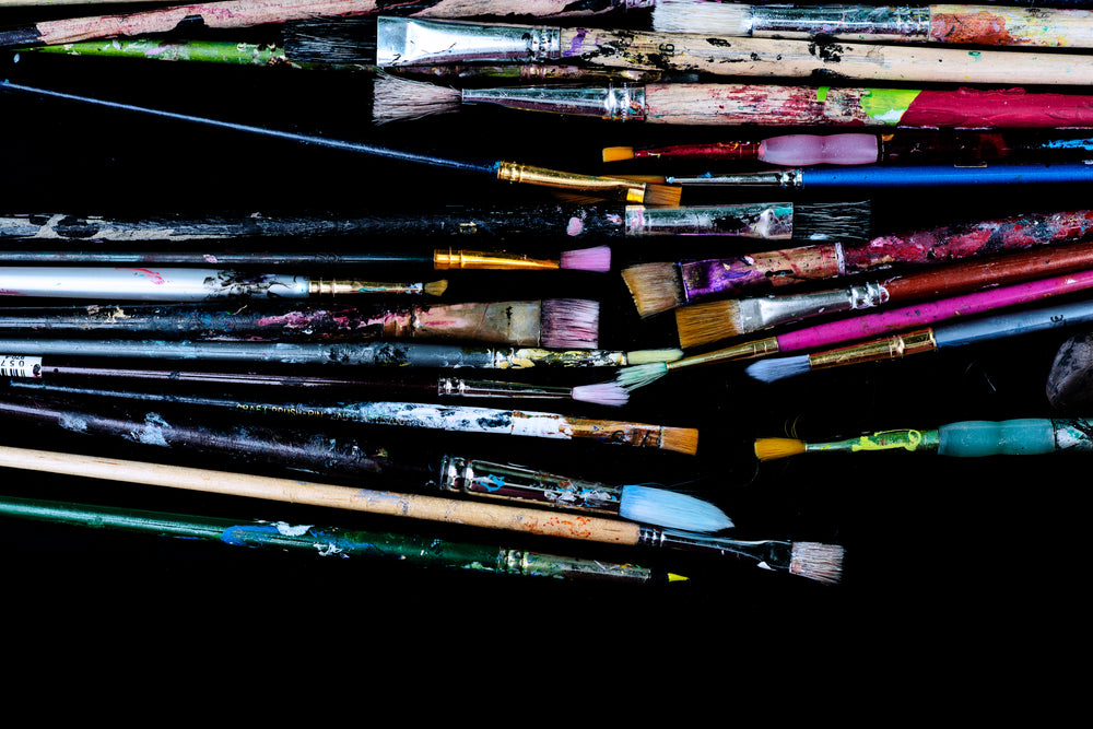 artists colorful paint brush collection laid out