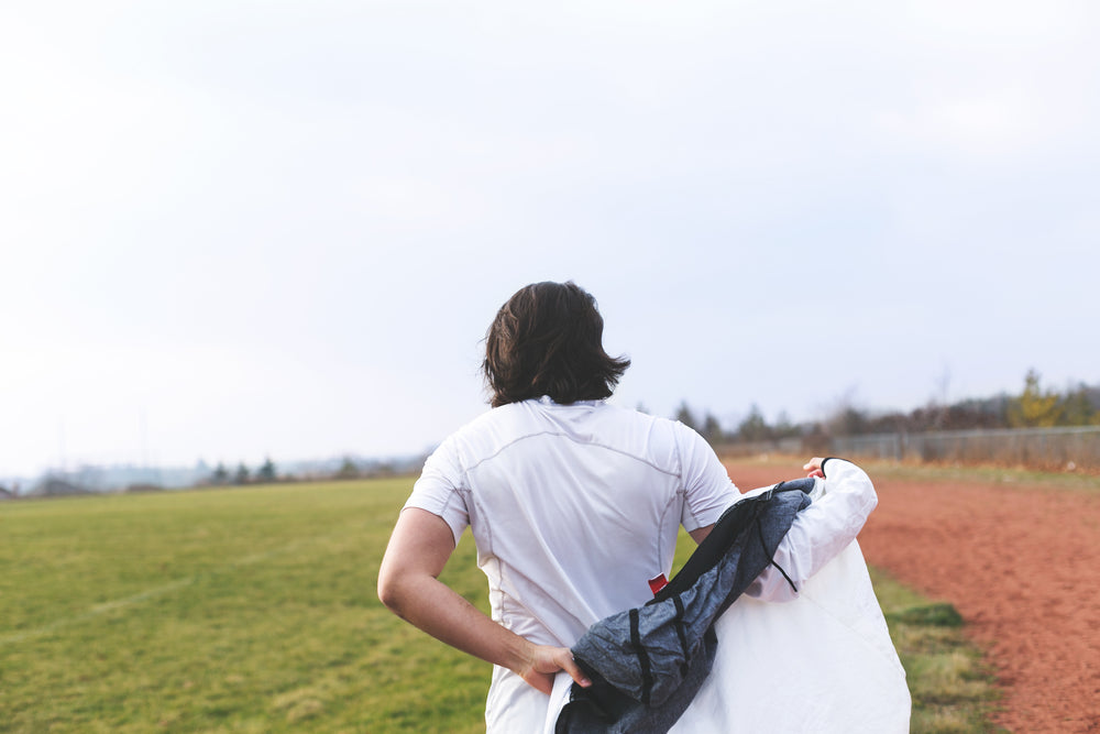 athlete putting on jacket