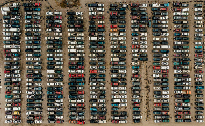 automotive wrecking yard aerial - a parking lot full of cars