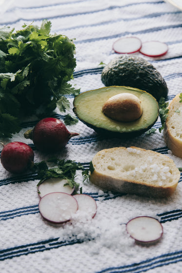 avocado and herbs on cloth