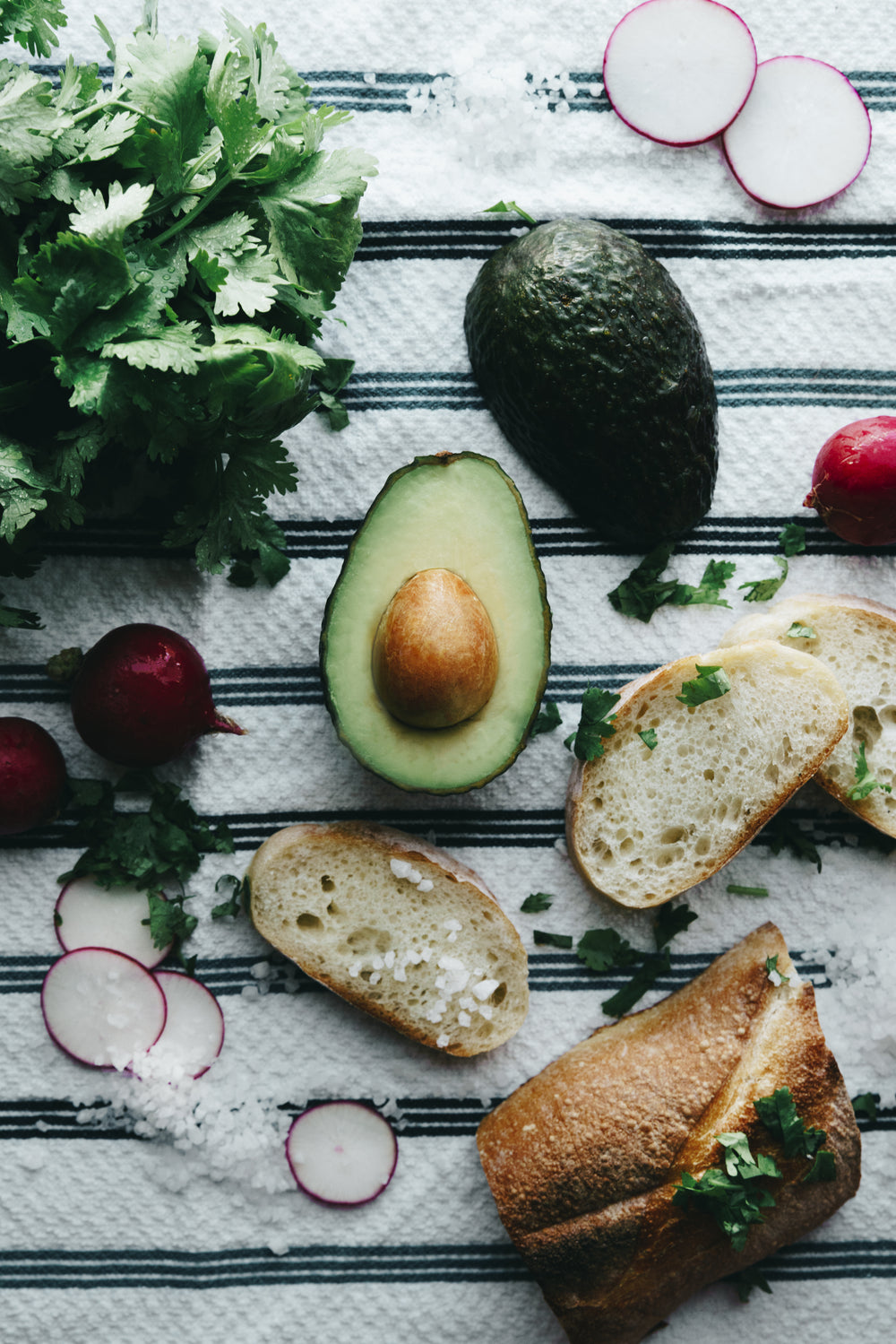 avocado and herbs on stripes