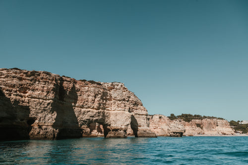 azure windows through craggy cliffs