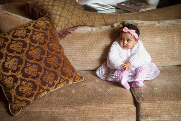baby girl on soft sofa