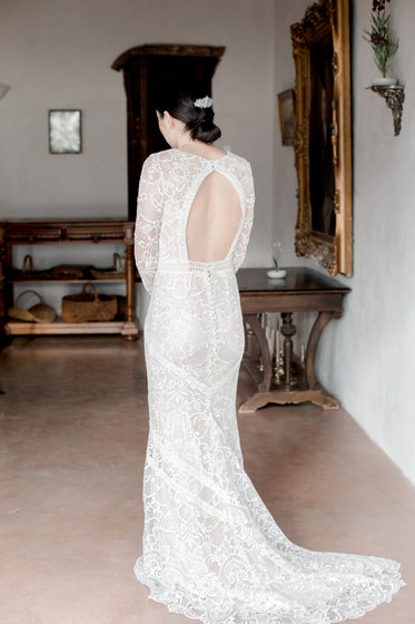 back of bride showing their white lace dress