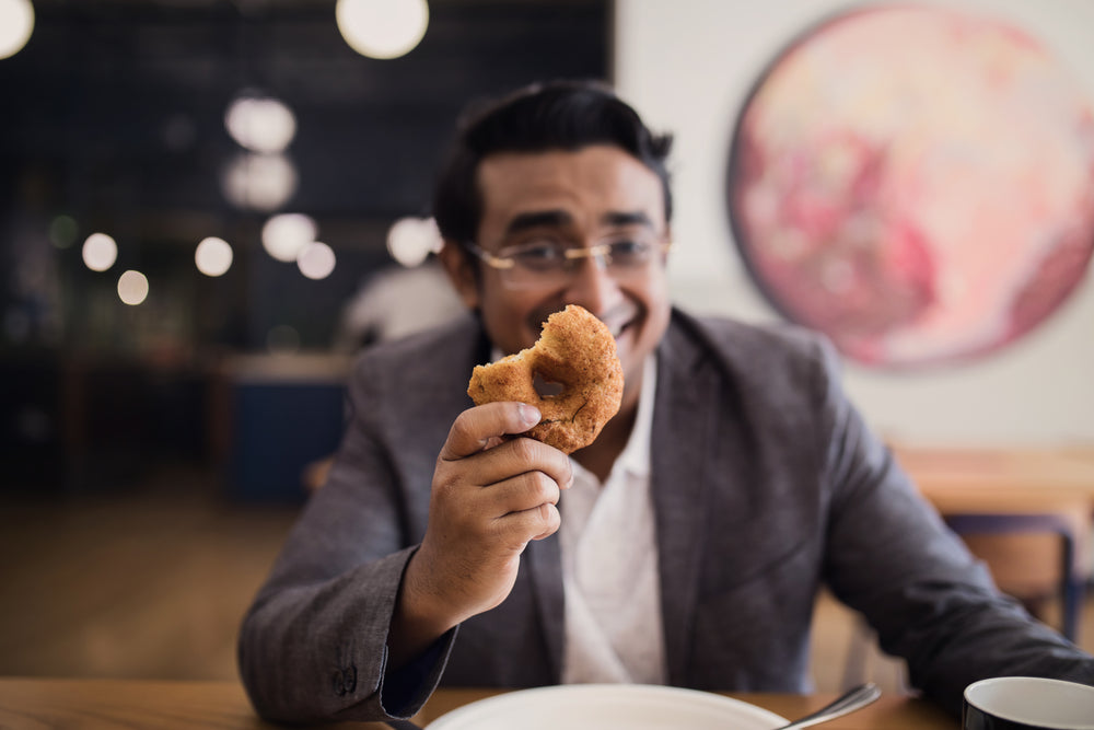 bakery treats in man's hand