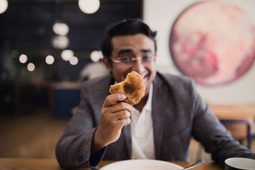 bakery treats in man's hand