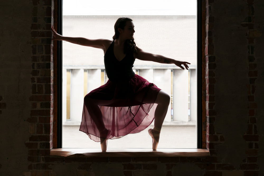 ballet dancer on pointe in window