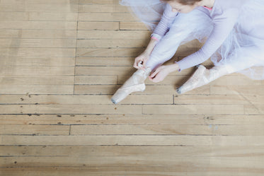 ballet shoes being tied up