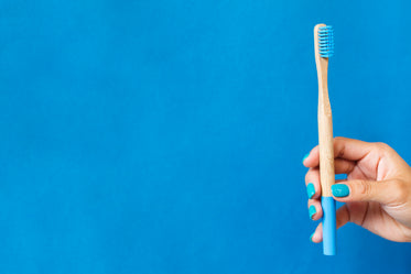 bamboo toothbrush on blue