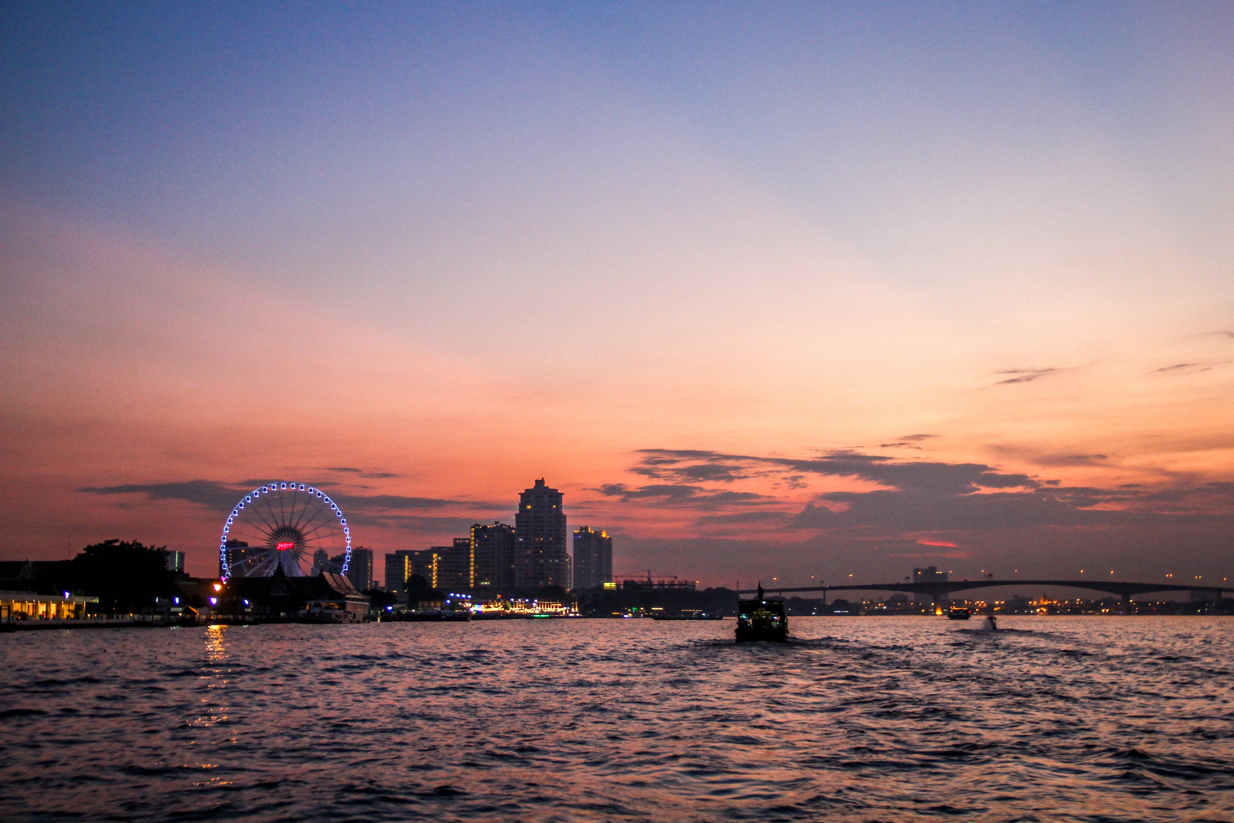 Bangkok skyline at sunset, seen from the water