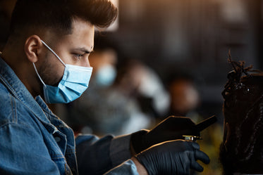 barber at work while wearing face mask