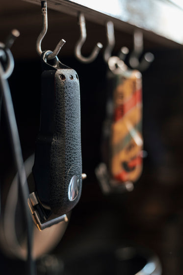 barber hair trimmers hang up on hooks