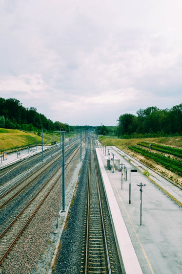 bare train tracks alongside an empty platform